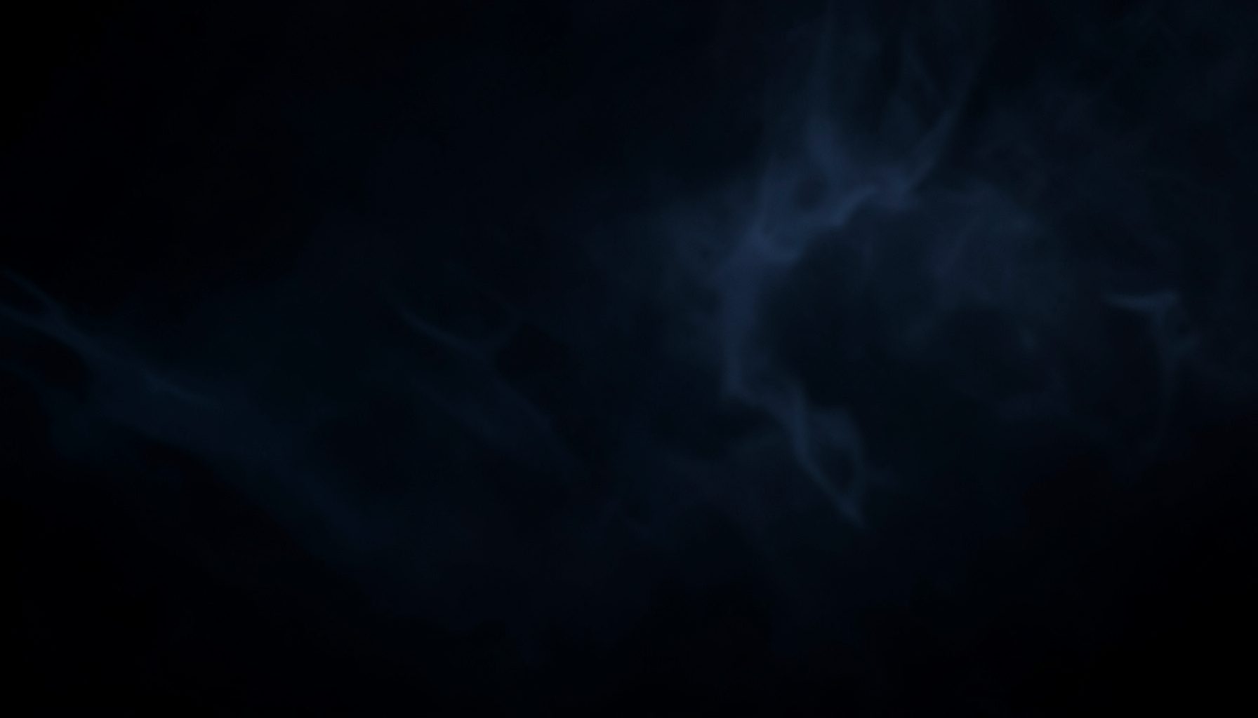 Dark atmospheric background with subtle vapor-like wisps in deep navy and charcoal tones, moody and premium