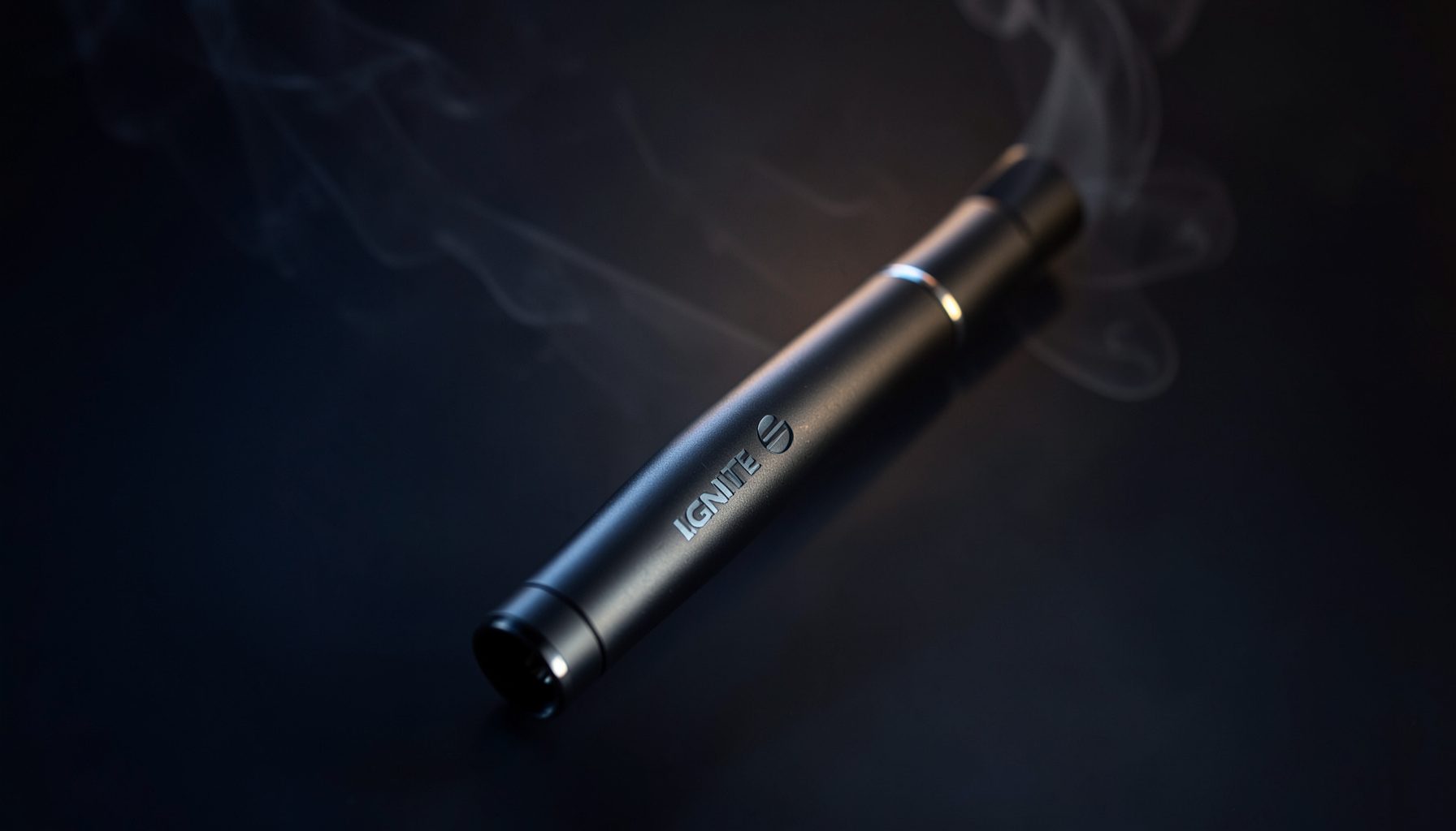 Close-up of a sleek IGNITE V15 disposable vape pen on a dark gradient background with subtle vapor wisps, deep navy and charcoal tones